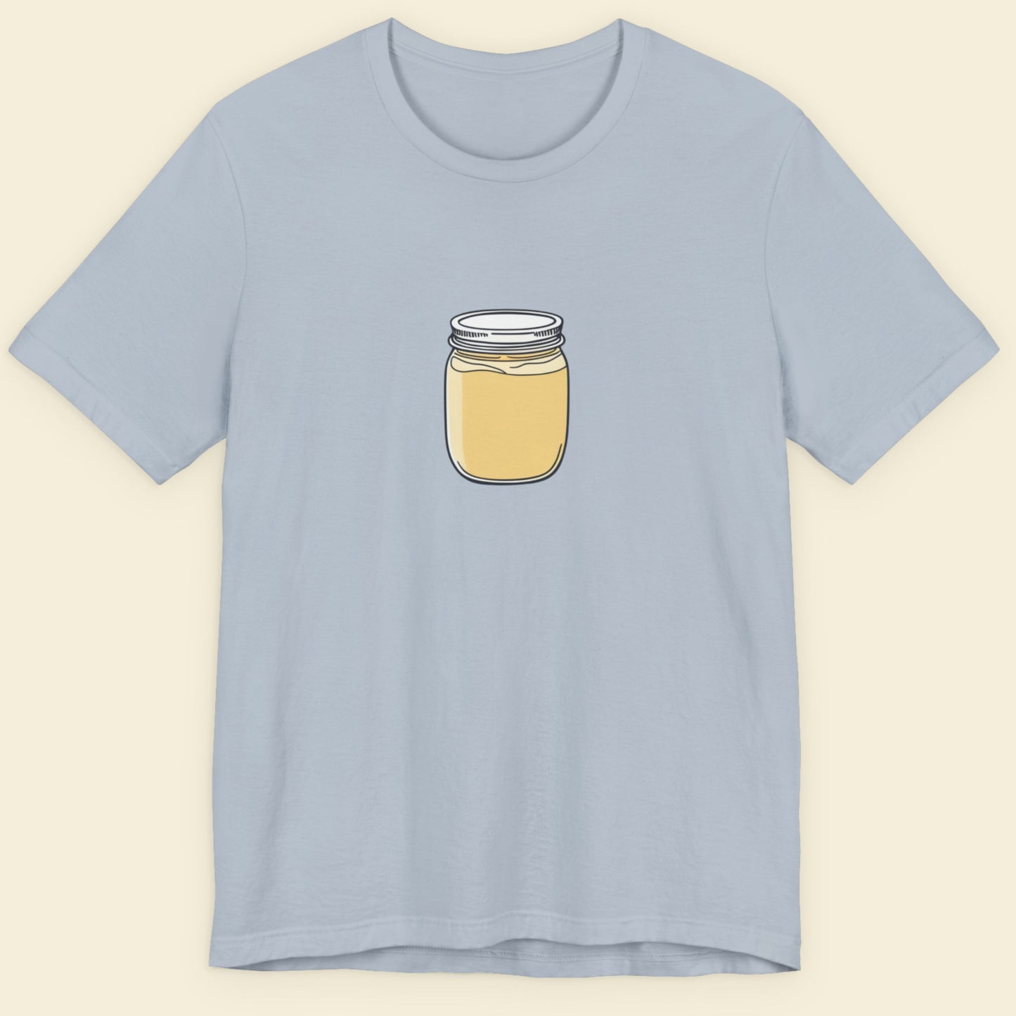 Light blue t-shirt with a jar graphic on a beige background