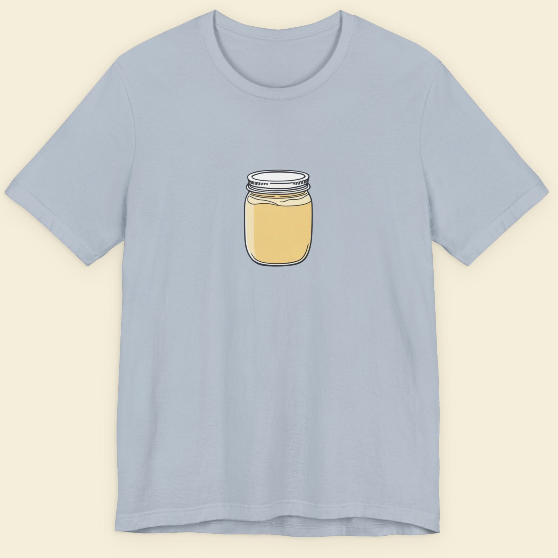 Light blue t-shirt with a jar graphic on a beige background