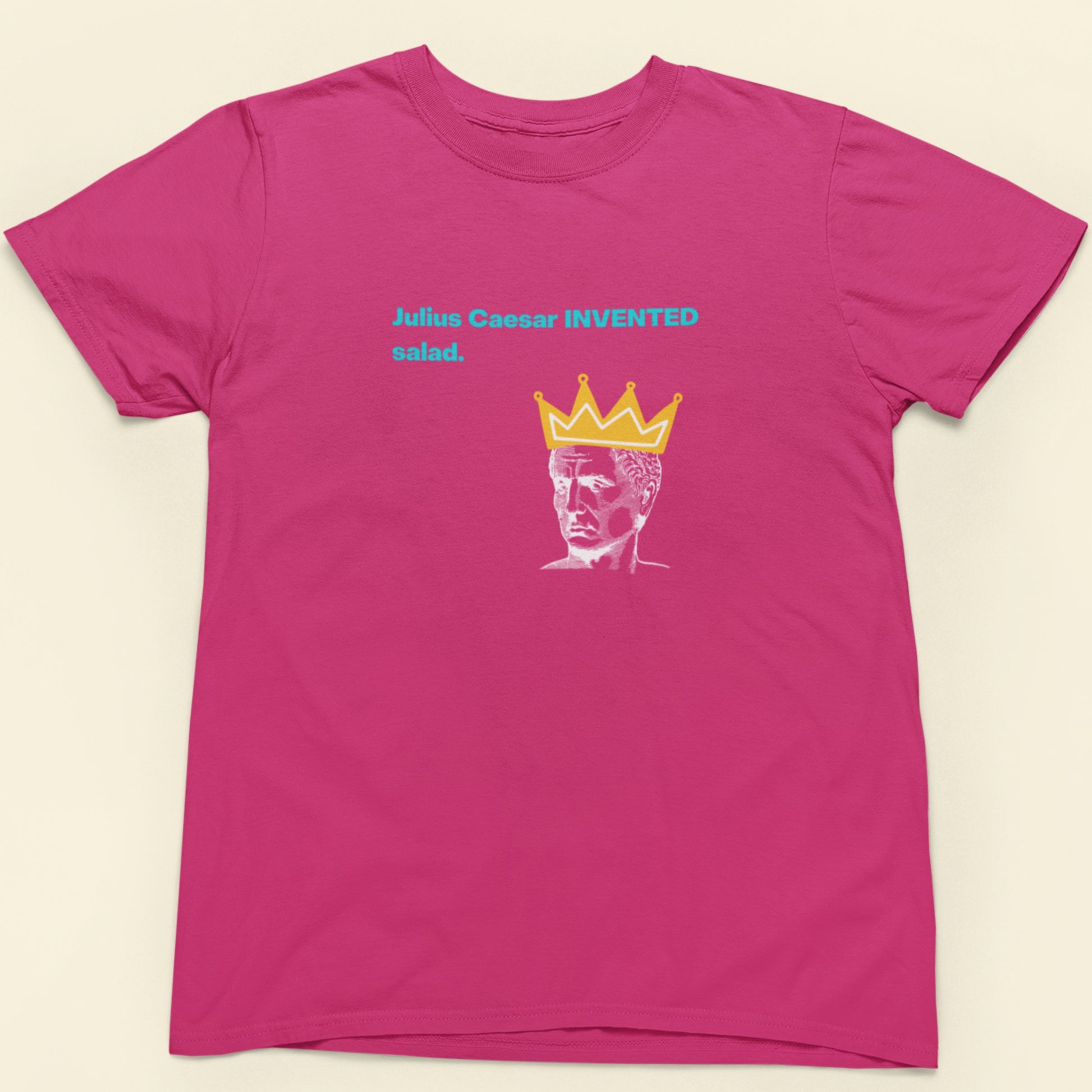 Pink t-shirt with graphic design and text on a beige background