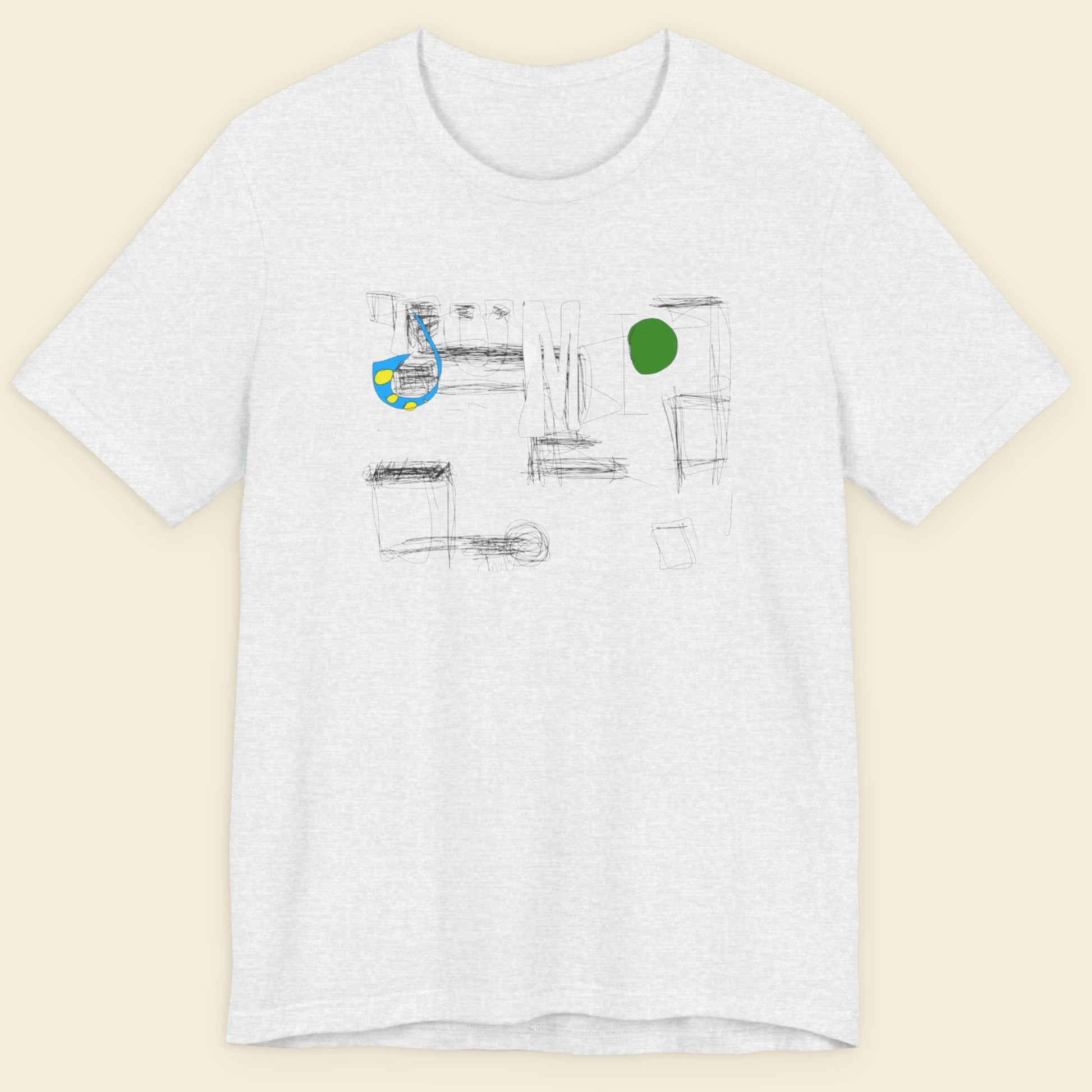 Ash grey t-shirt with abstract design on a beige background.