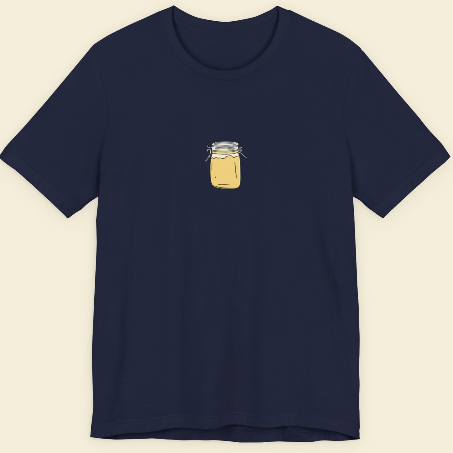 Navy blue t-shirt with a small yellow jar graphic on a beige background