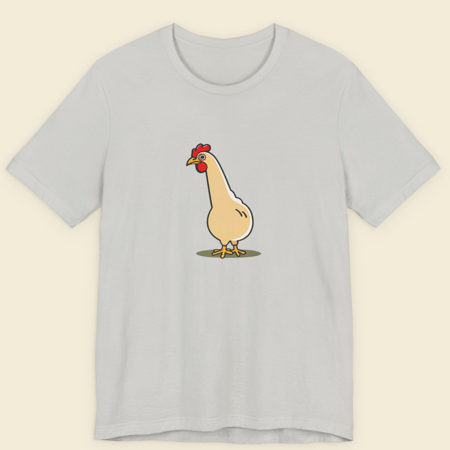 Light gray t-shirt with a cartoon chicken design on a beige background