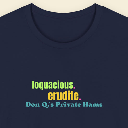 Navy blue t-shirt with humorous colorful text on a beige background.
