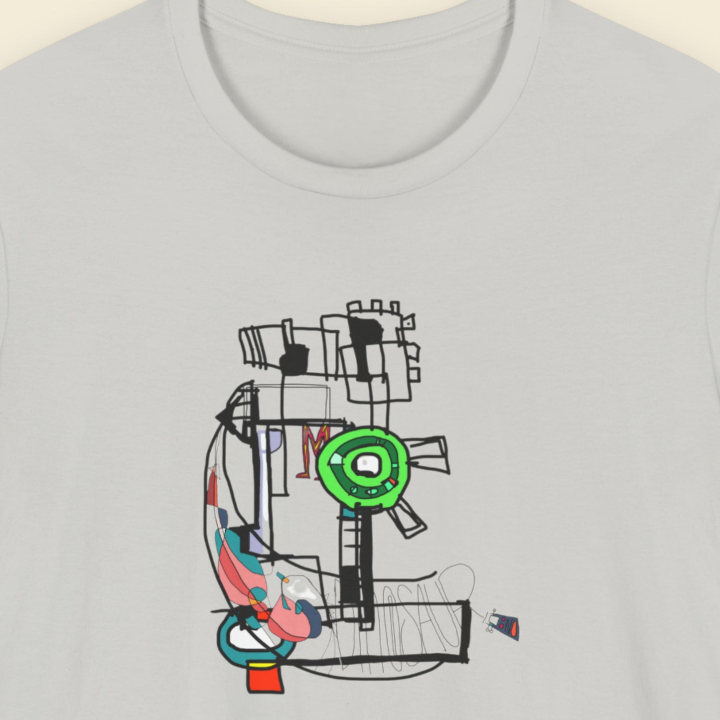 Light grey t-shirt with a colorful abstract drawing on a beige background.