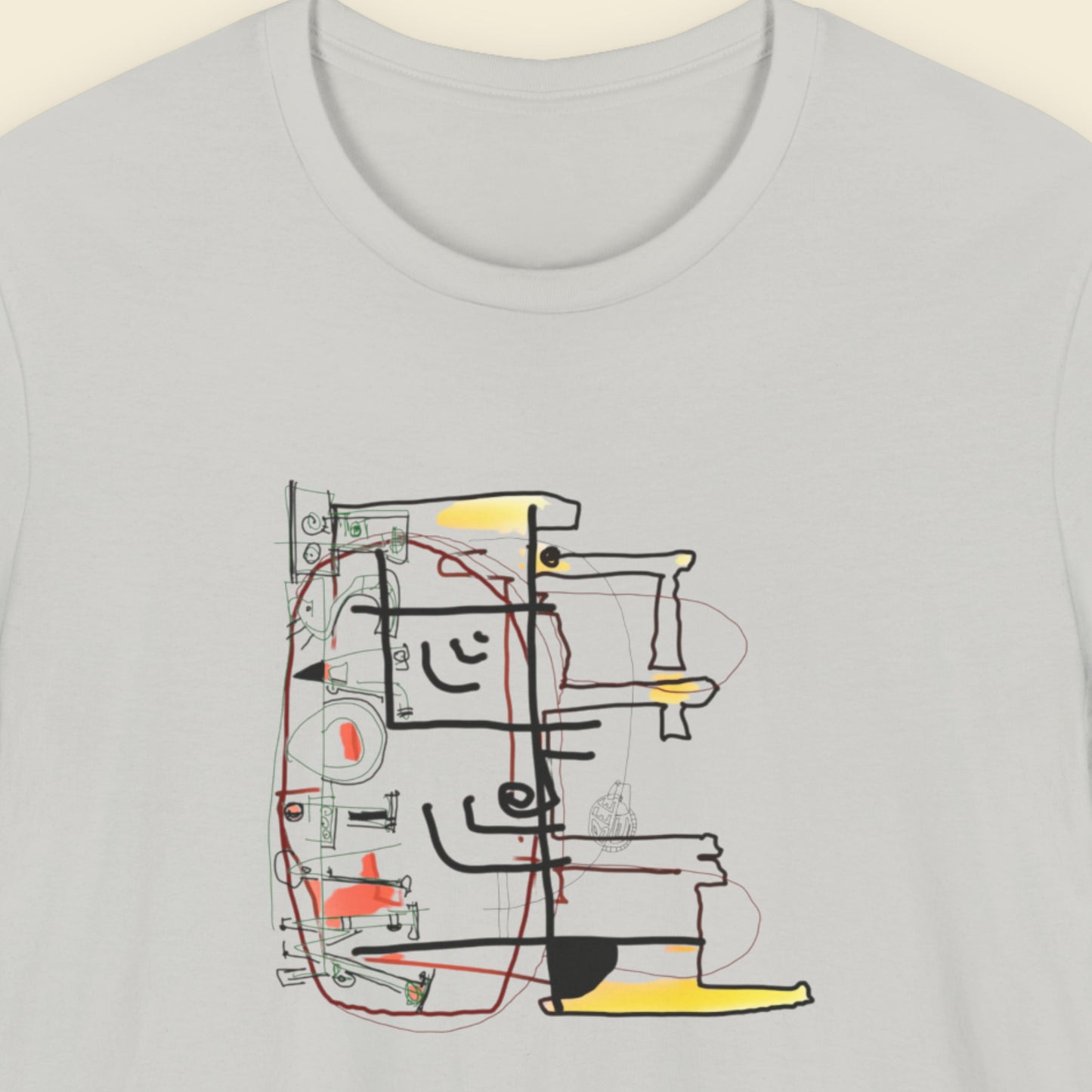 Grey t-shirt with a colorful abstract diagram drawing on a beige background.