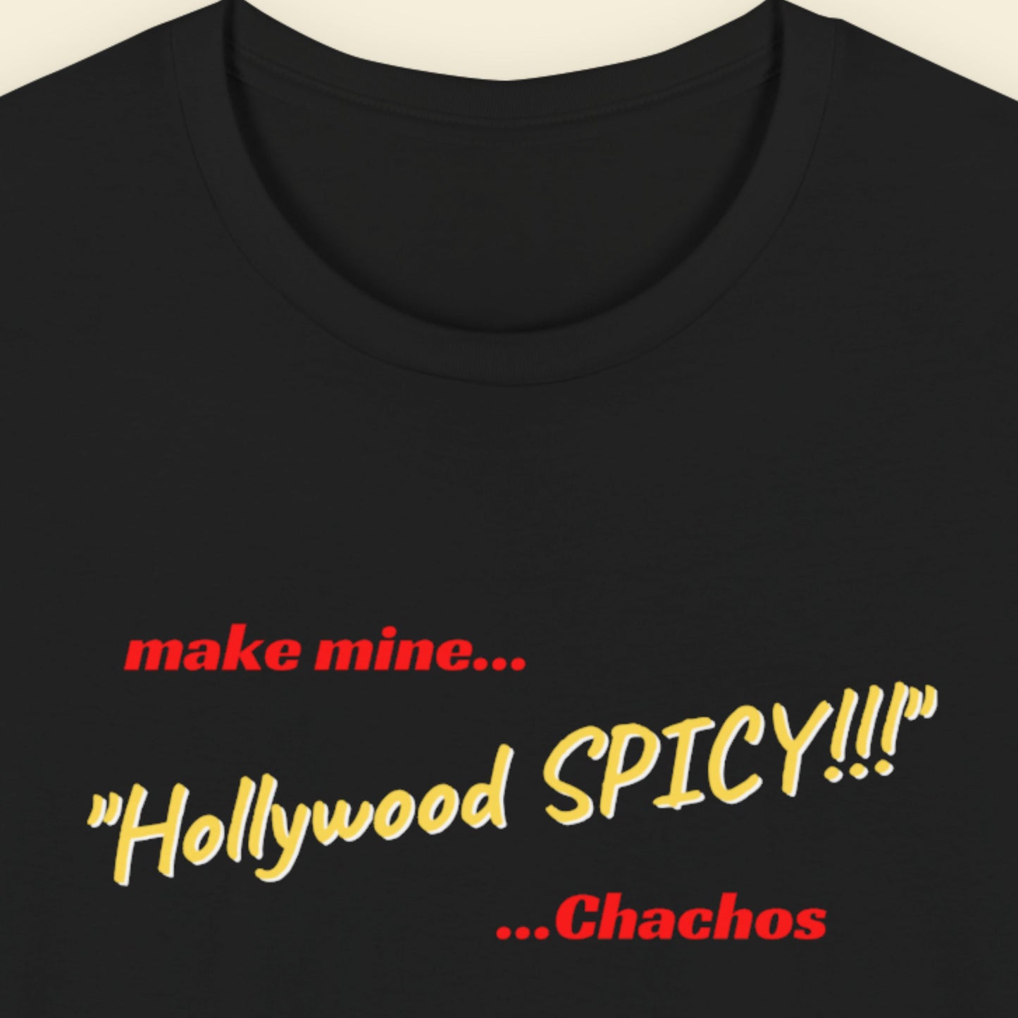 Black t-shirt with red and yellow text on a beige background.