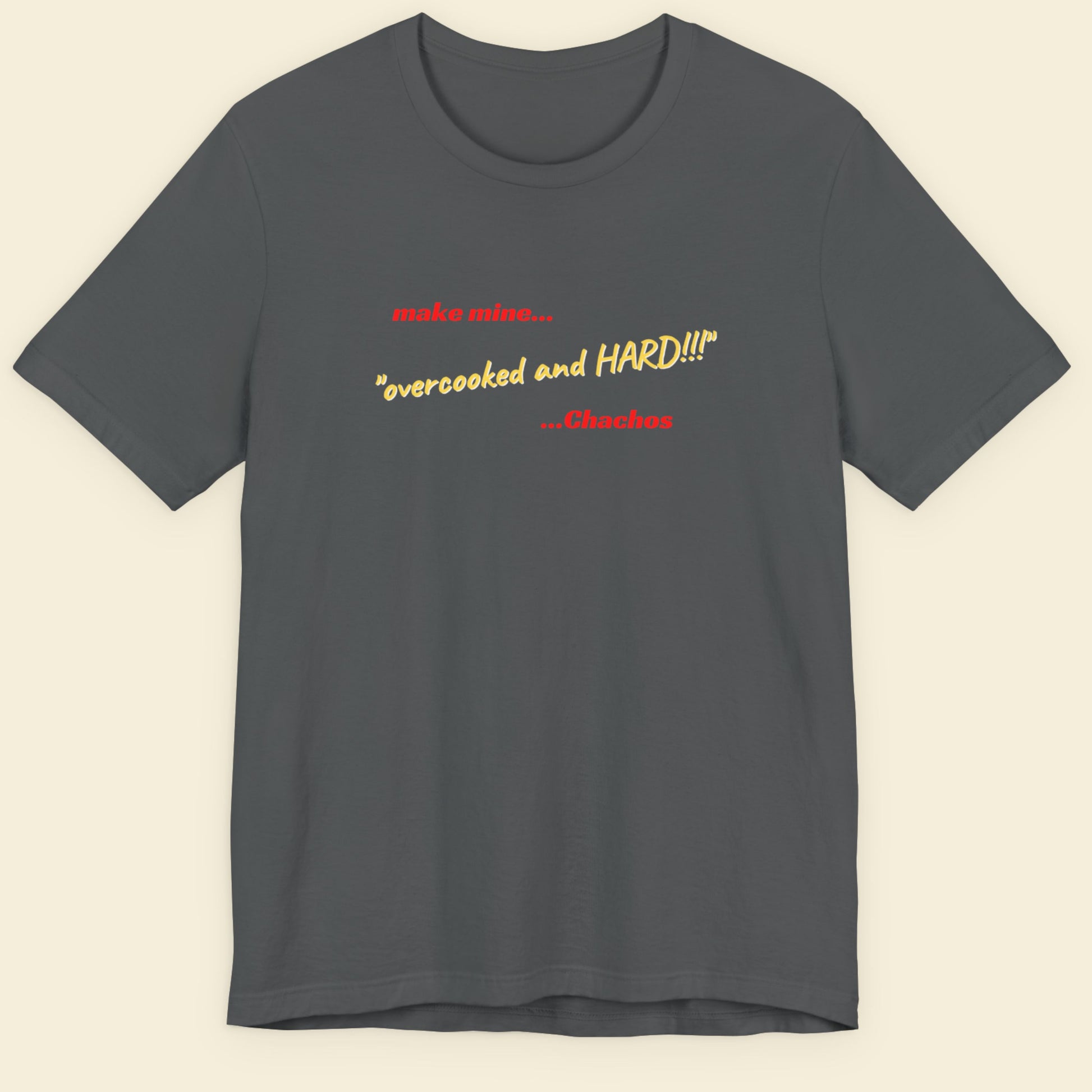Gray t-shirt with yellow and red text on a beige background.
