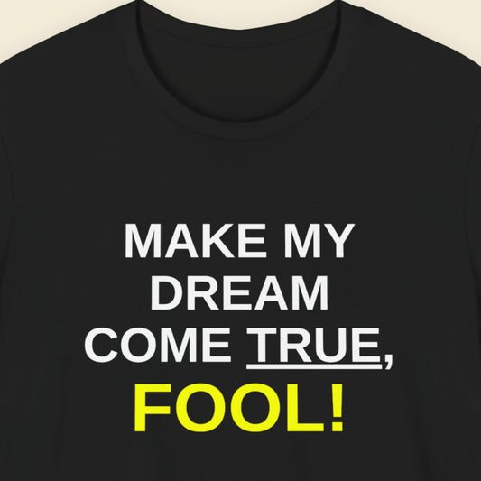 Black t-shirt with white and yellow text on a beige background.