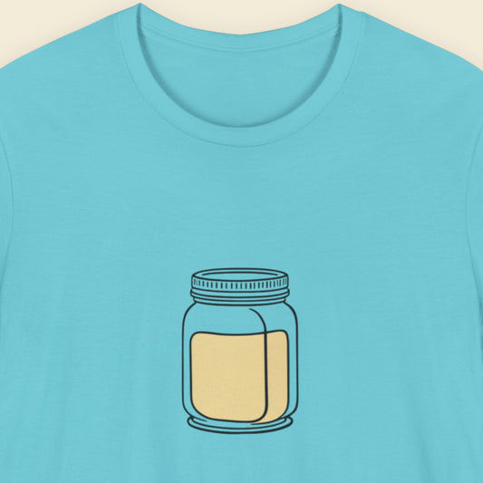 Blue t-shirt with a jar graphic on a beige background.