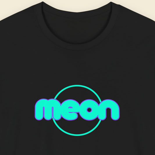 Black t-shirt with humorous colorful text on a beige background.