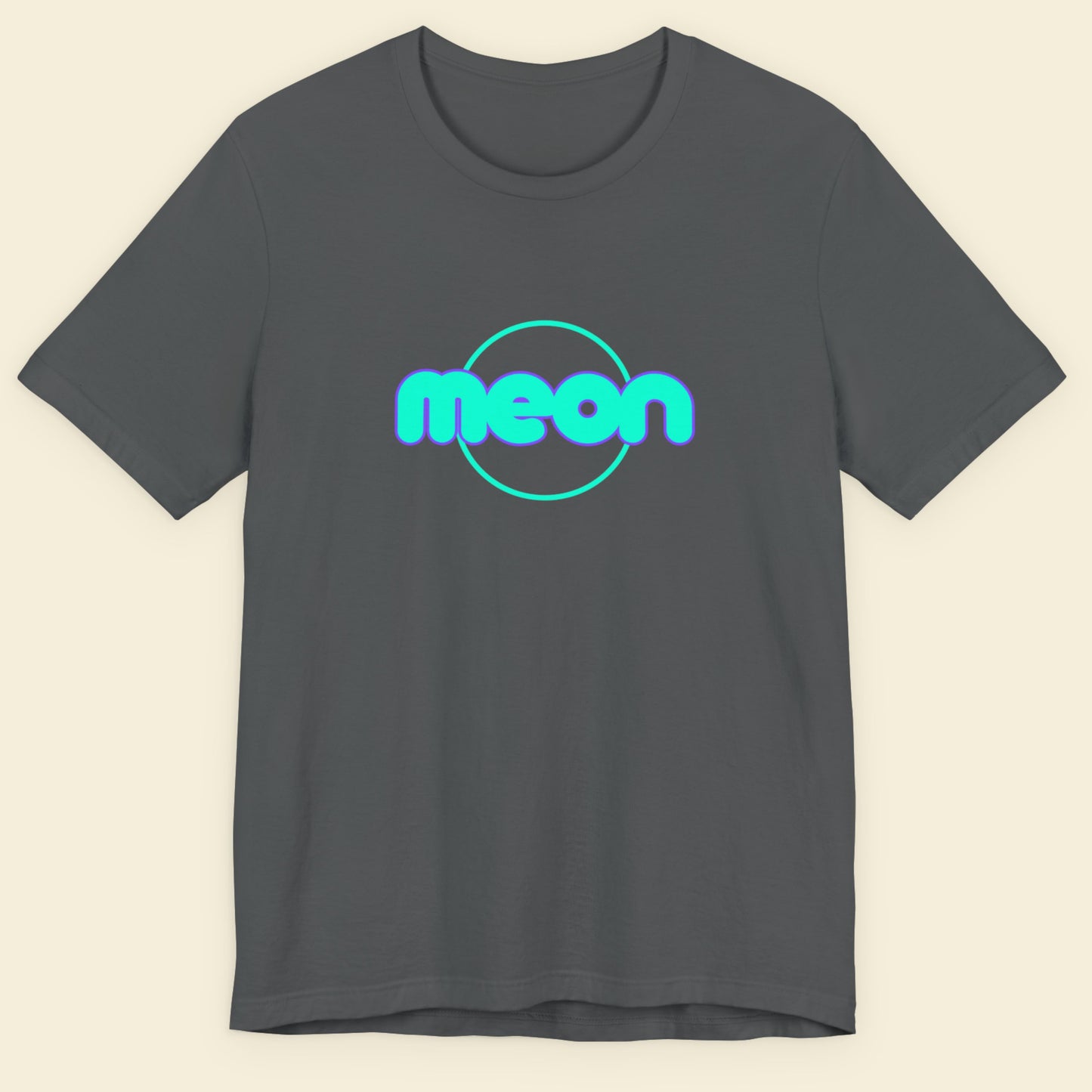 Gray t-shirt with 'meon' logo on a beige background.