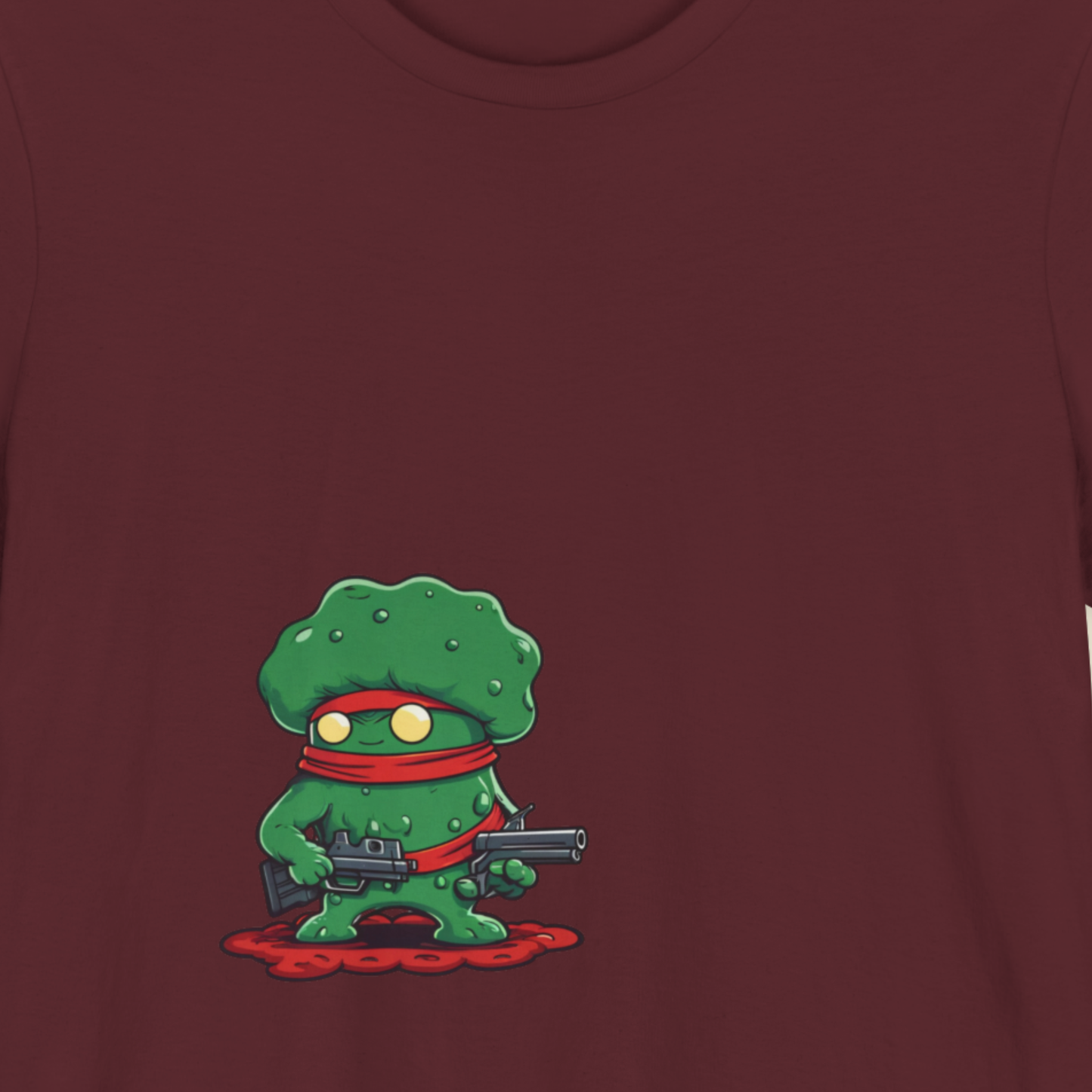Maroon t-shirt featuring a cartoon drawing of Tough Guy, 'Mighty Klerbb' on a beige background.