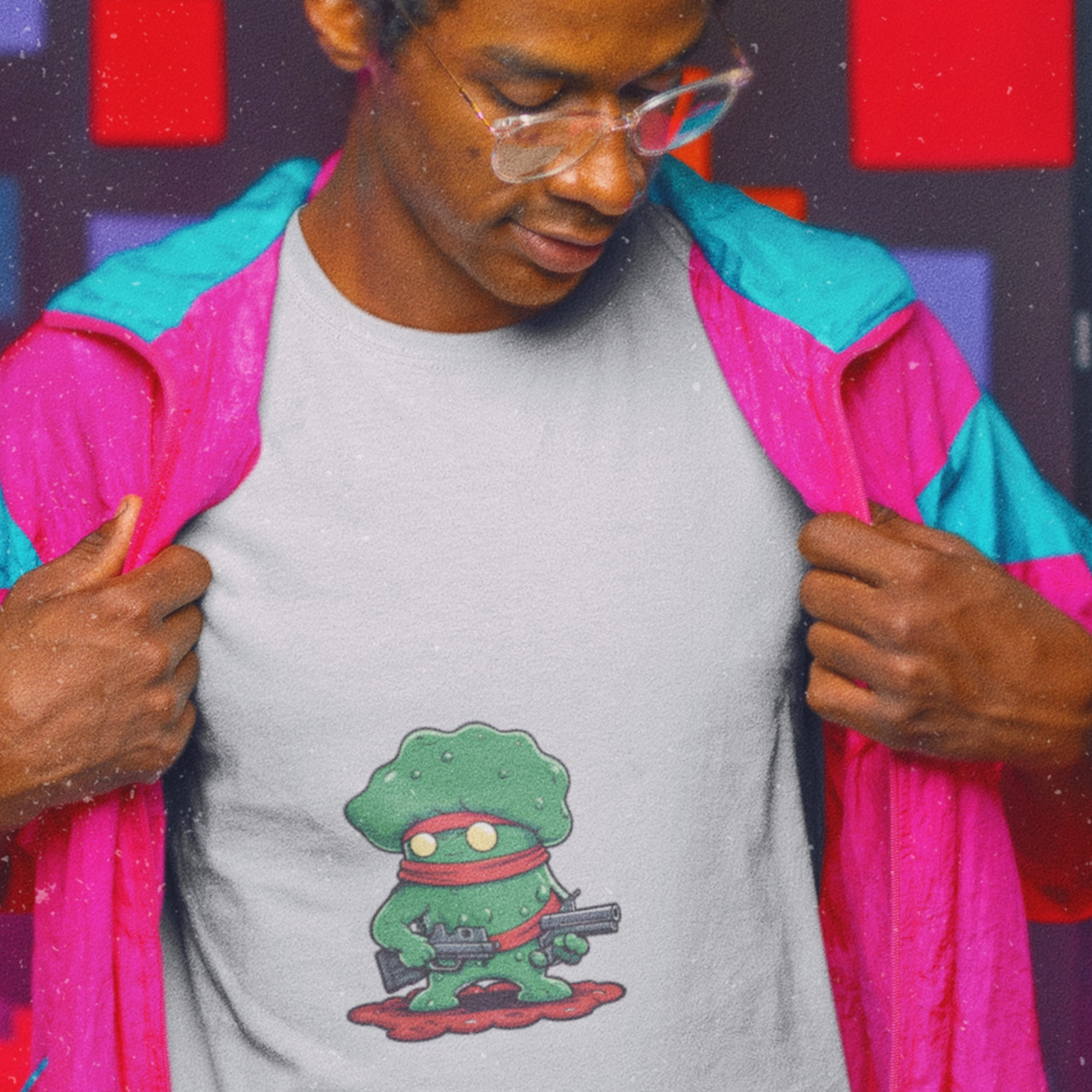 Man wearing a t-shirt featuring a cartoon drawing of Tough Guy, 'Mighty Klerbb' on a colorful background.