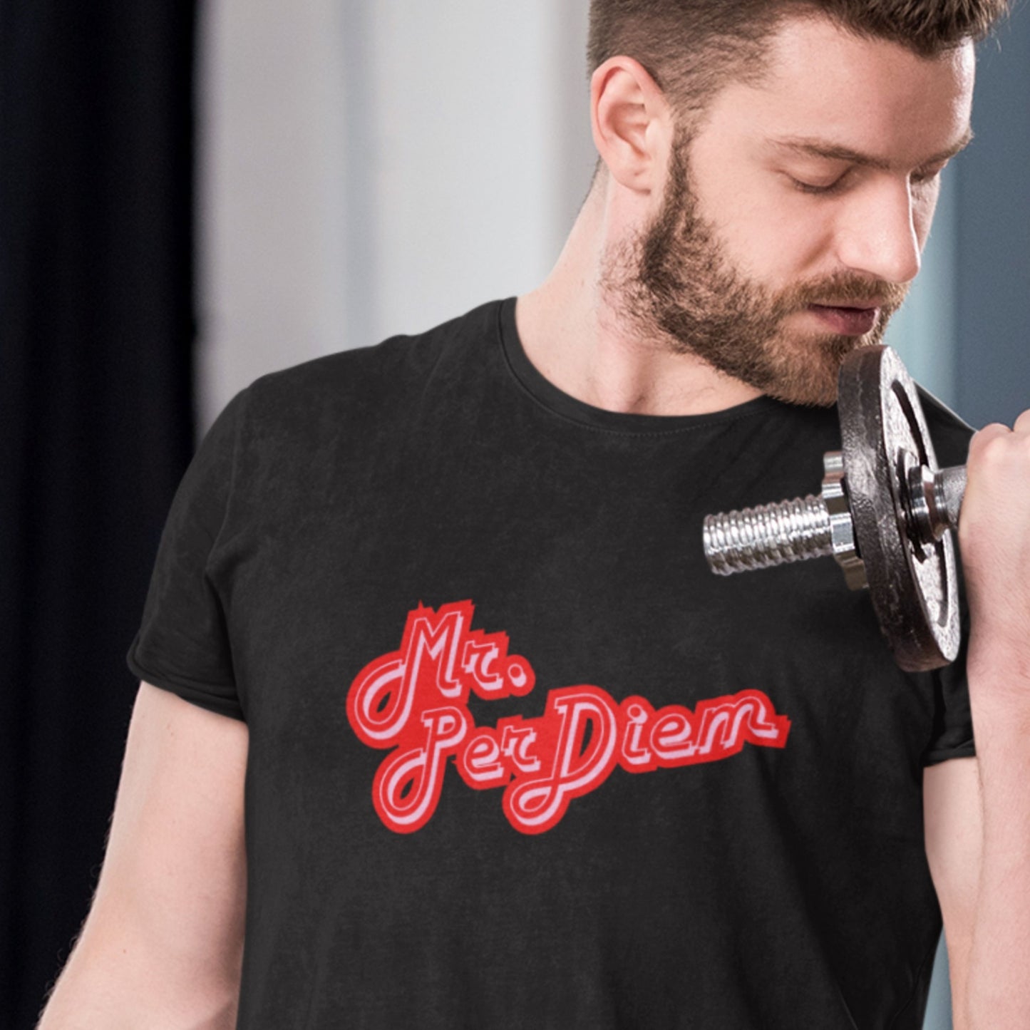 Man lifting a dumbbell wearing a black t-shirt with 'Mr. Per Diem' in red.