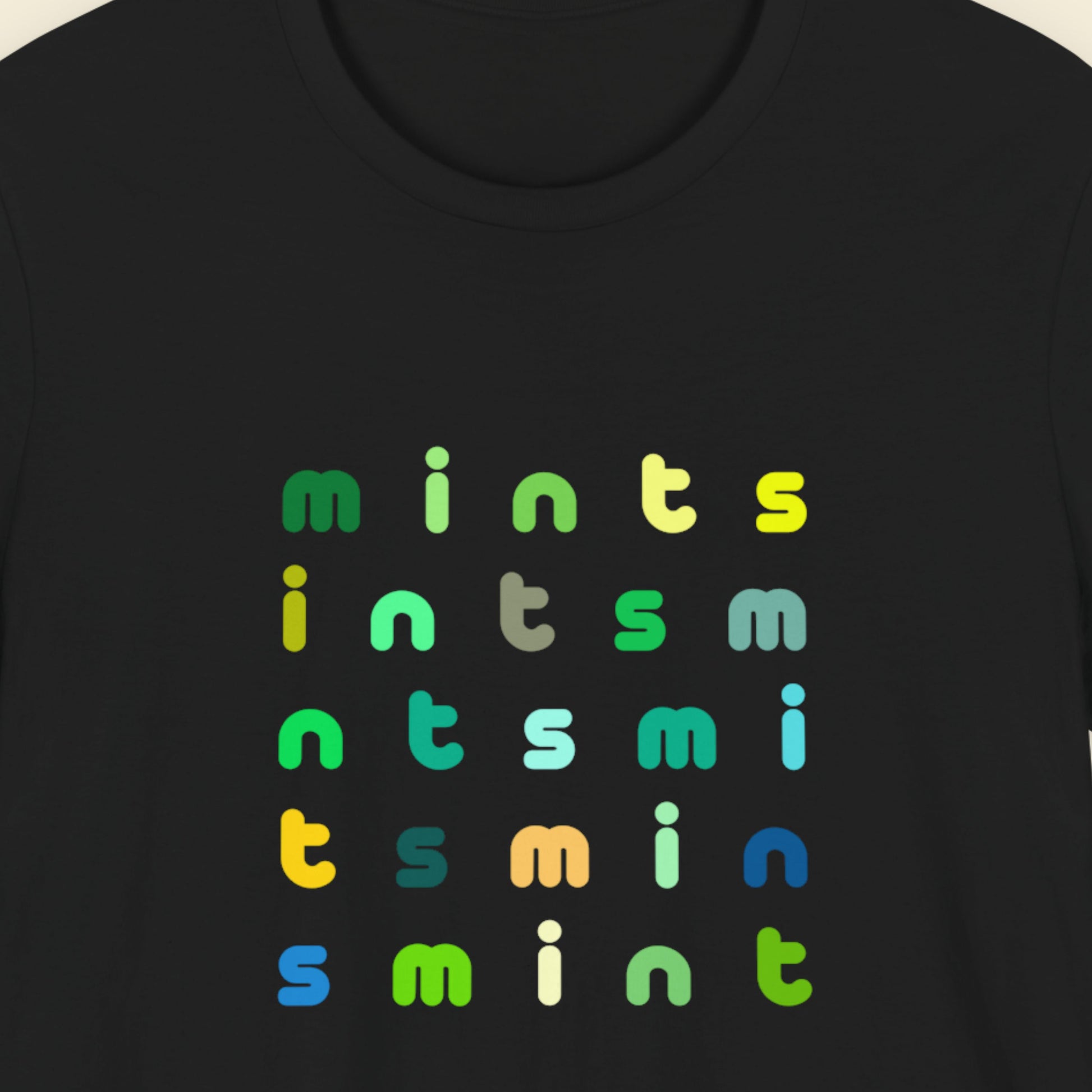 Black t-shirt with colorful 'mints' text pattern.