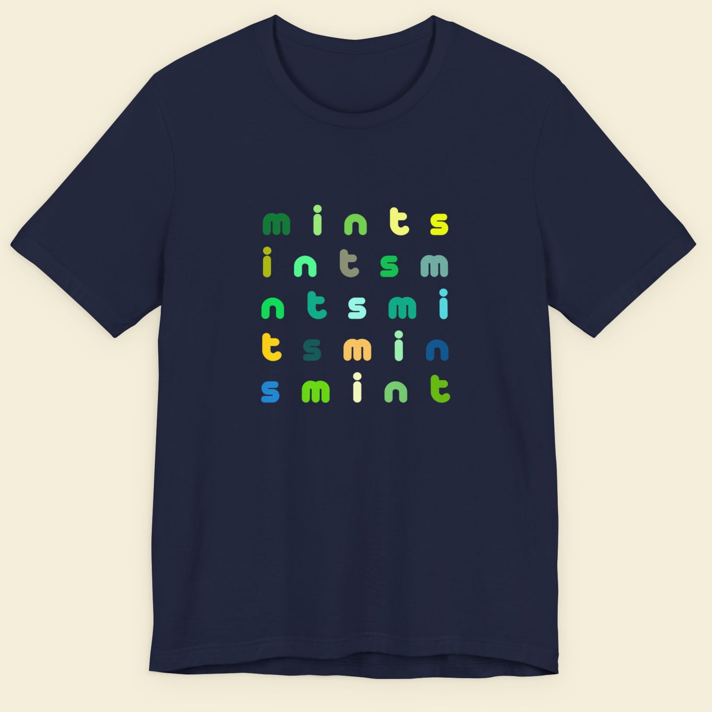 Navy blue t-shirt with colorful 'mints' text pattern on a beige background.
