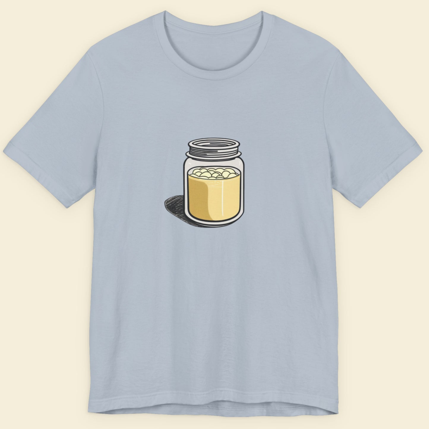 Light blue t-shirt with a jar graphic on a beige background.