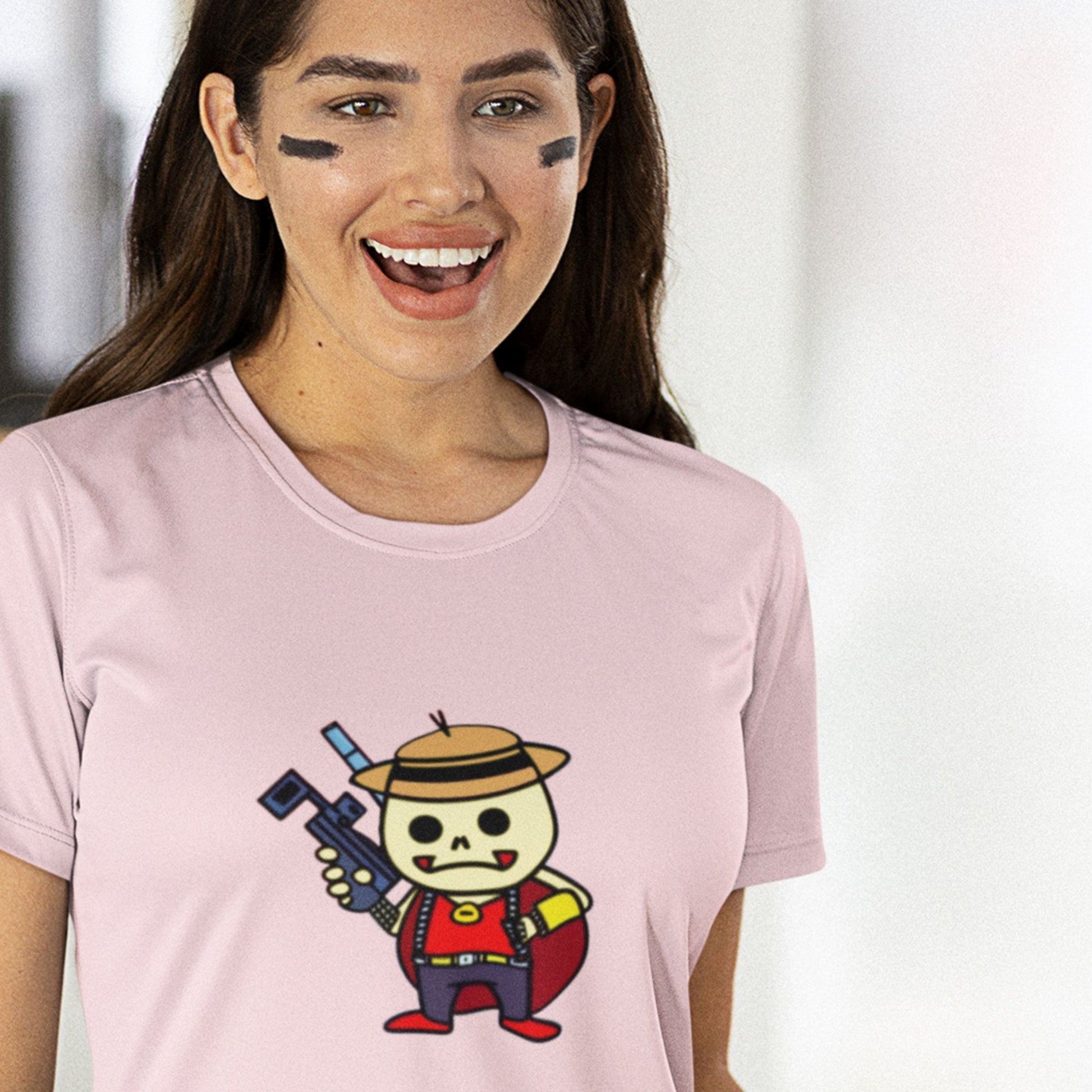 Sports woman wearing a pink t-shirt with a fun, colorful cartoon bounty hunter illustration in a living room.