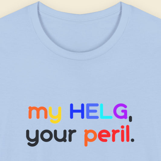Light blue t-shirt with colorful Swedish text design on a beige background.