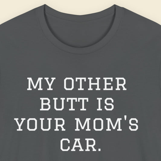 Gray t-shirt with white text 'MY OTHER BUTT IS YOUR MOM'S CAR.' on a beige background.