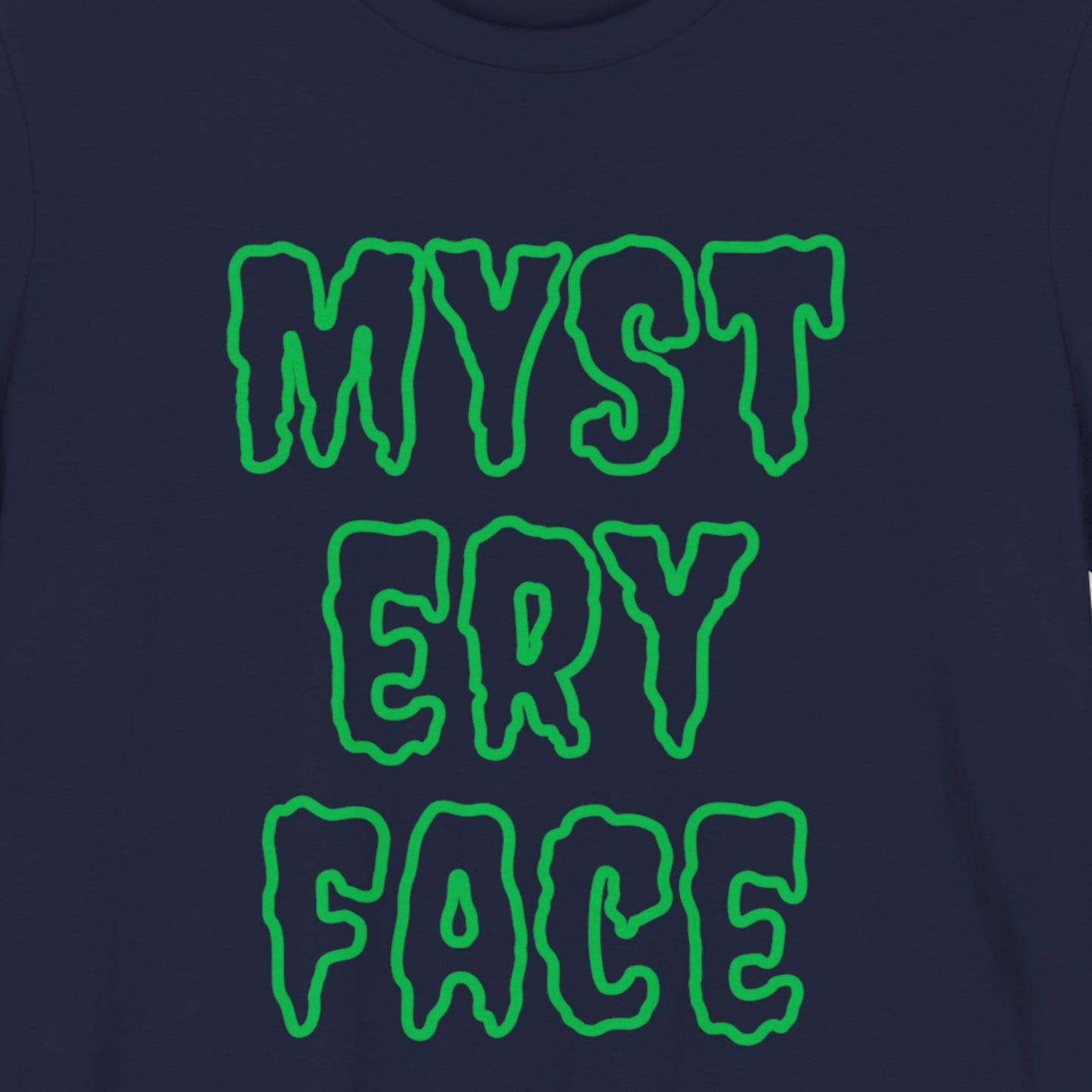 Navy blue t-shirt with green 'MYSTERY FACE' text on a plain background.