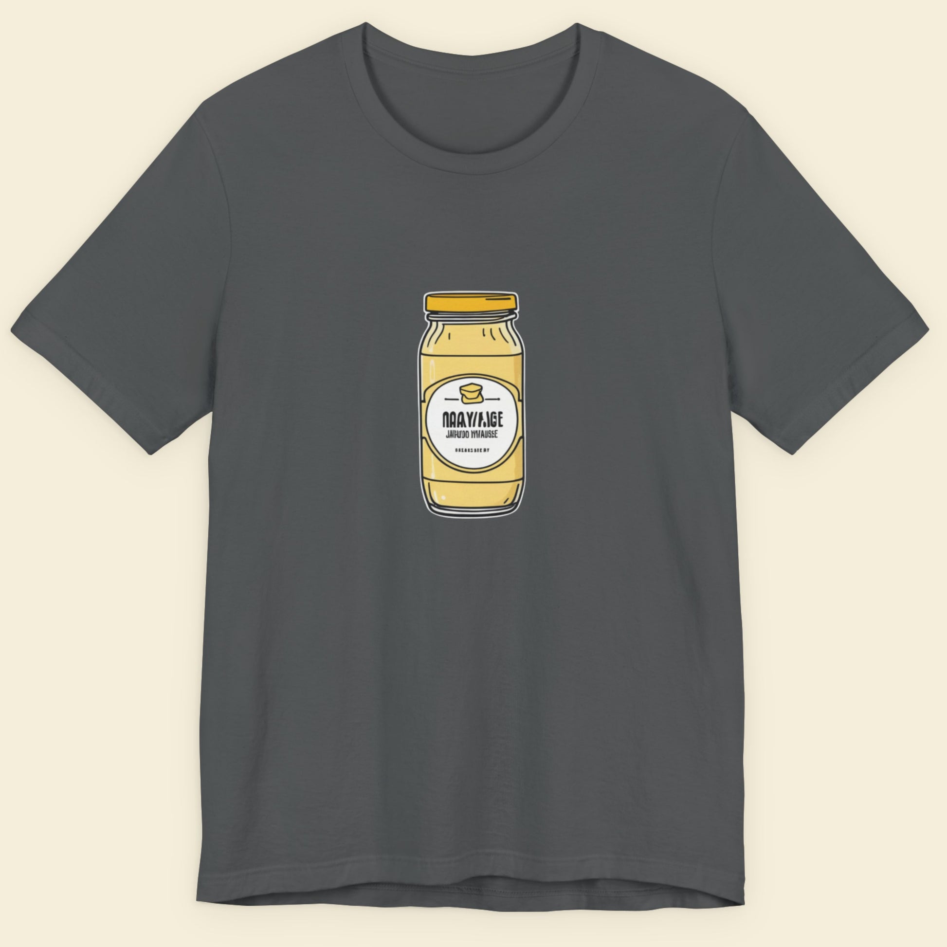 Grey shirt with a drawing of a jar of specialty Dijonaise against a beige background.