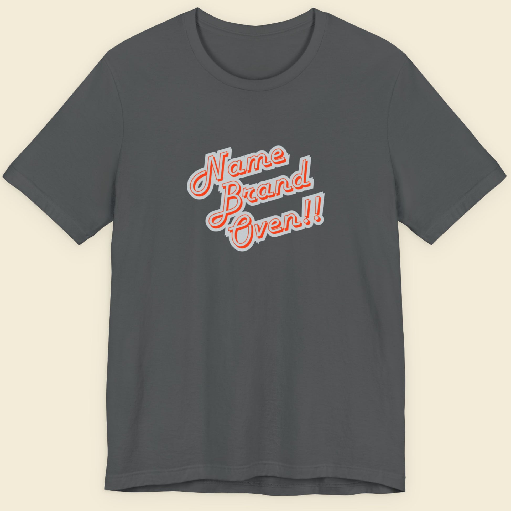 Gray t-shirt with 'Name Brand Over!!' text in red and white on a beige background.
