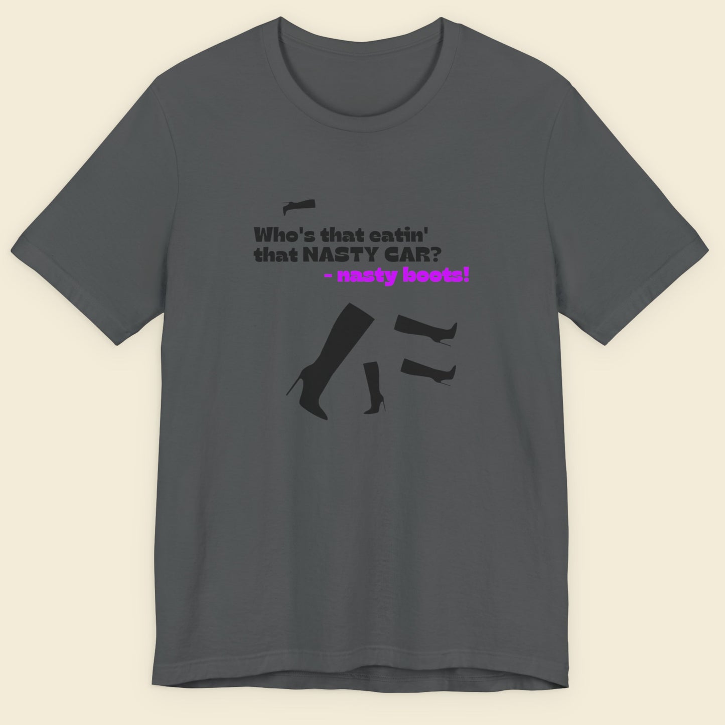 Gray t-shirt with black and purple text and graphics on a beige background.