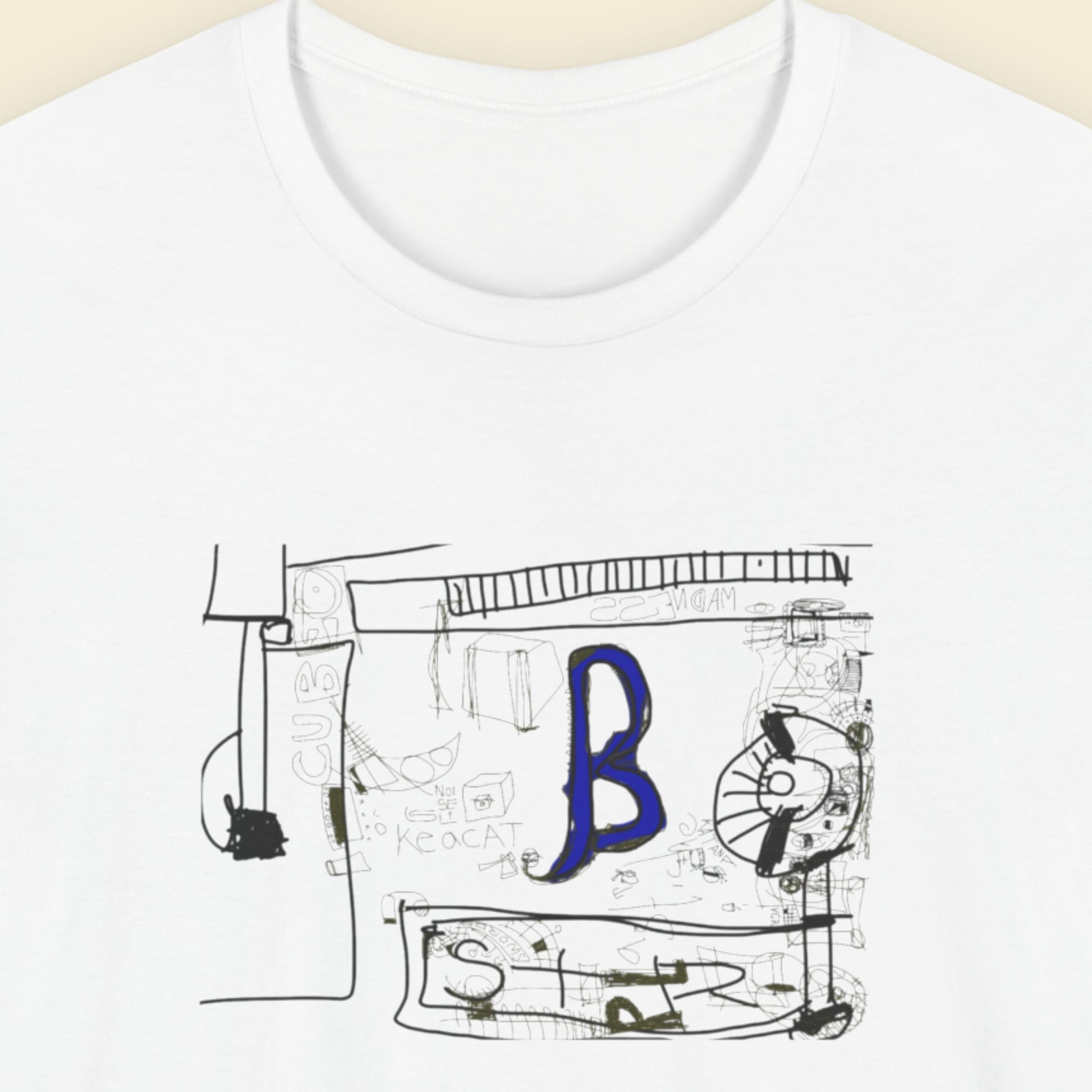 White t-shirt with a graphic design featuring a blue letter 'B' on a beige background.