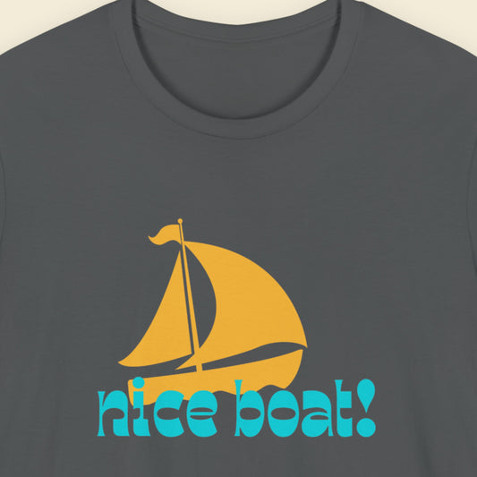 Gray t-shirt with a yellow sailboat graphic and 'nice boat!' text on a beige background.