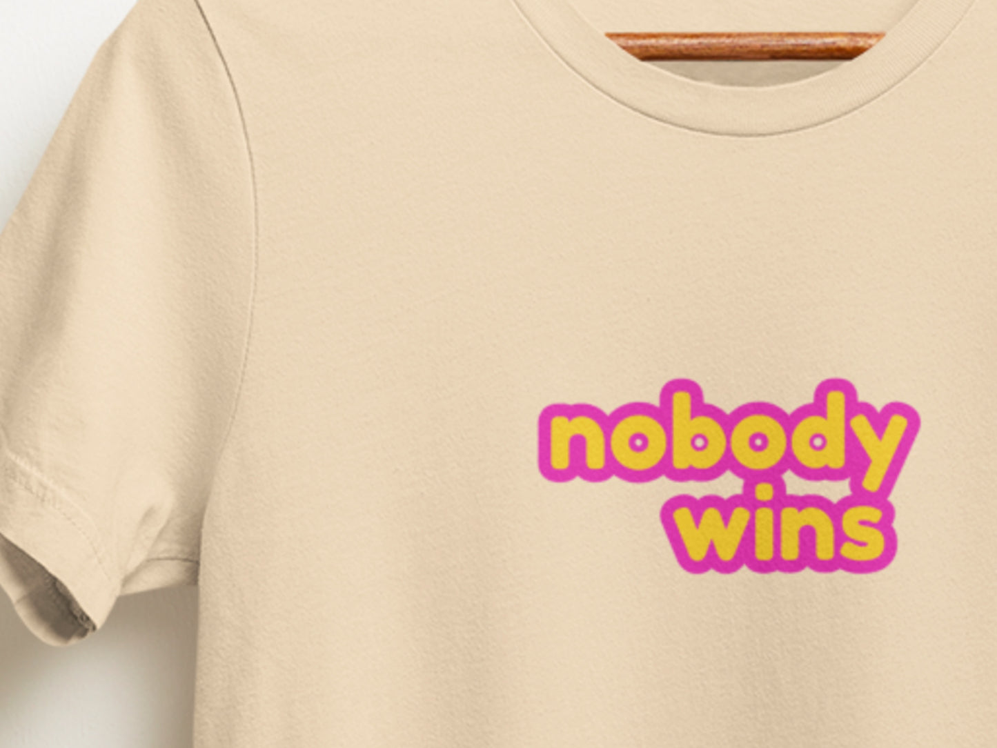 Nobody Wins Soft Cream T-Shirt.