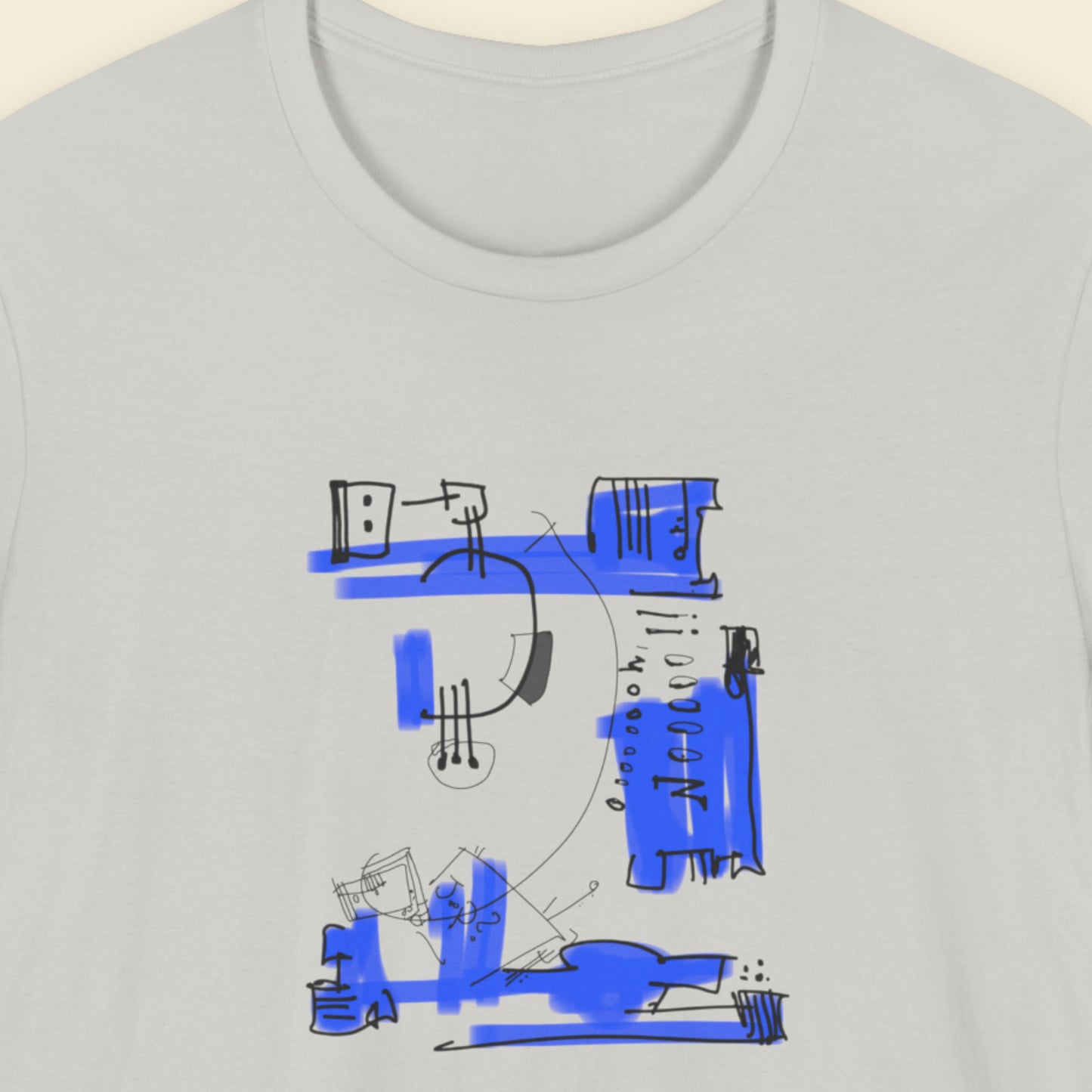 Light grey t-shirt with a colorful abstract drawing on a beige background.