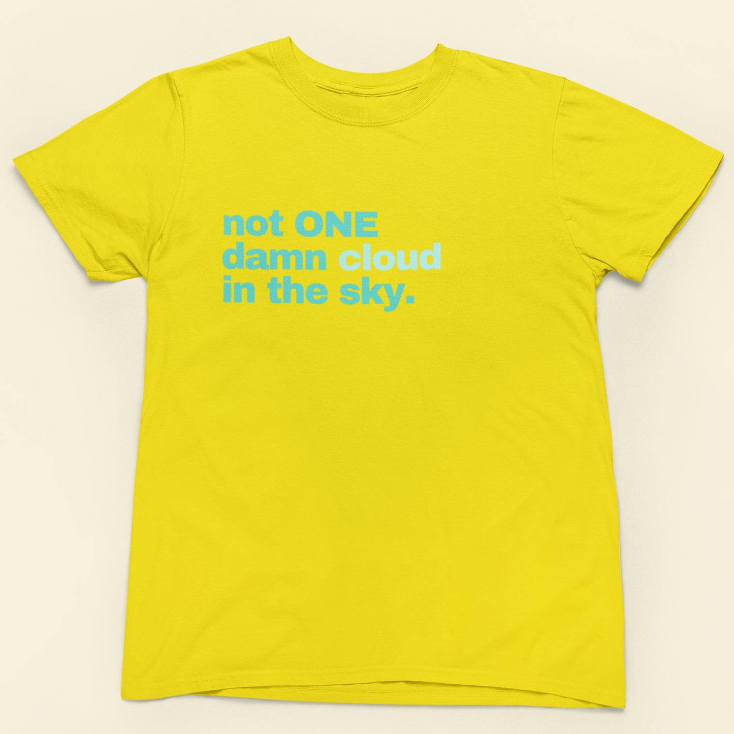 Yellow t-shirt with blue text on a beige background