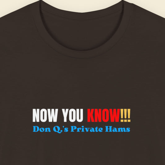 Brown t-shirt with multicolored 'now you know!!!' text on a beige background.