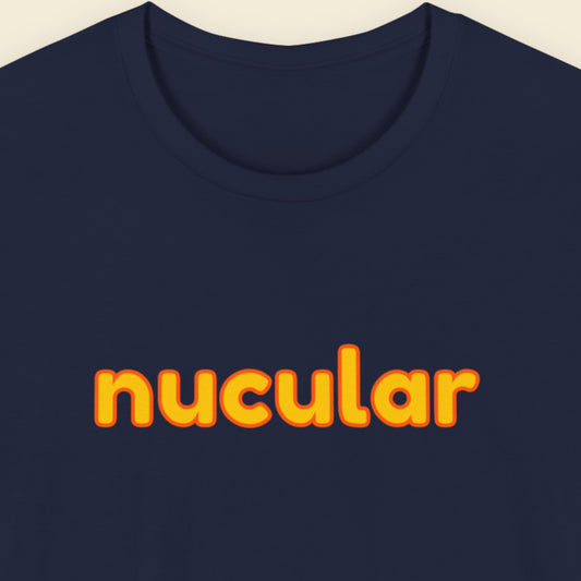 Navy blue t-shirt with humorous colorful text on a beige background.
