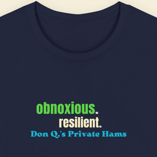 Navy t-shirt with humorous colorful text on a beige background.