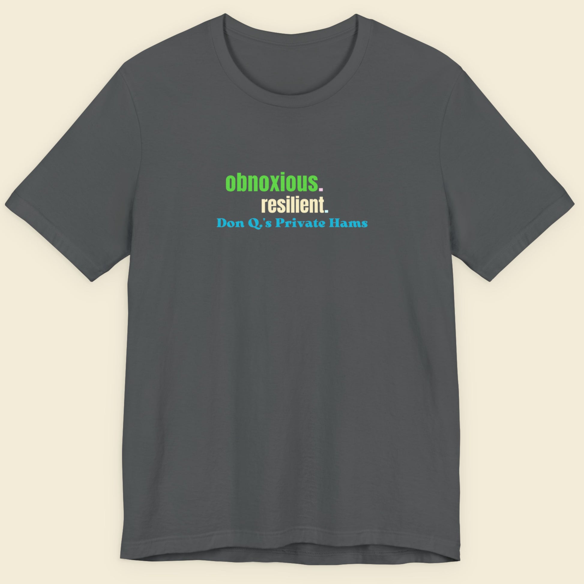 Gray t-shirt with text on a beige background.