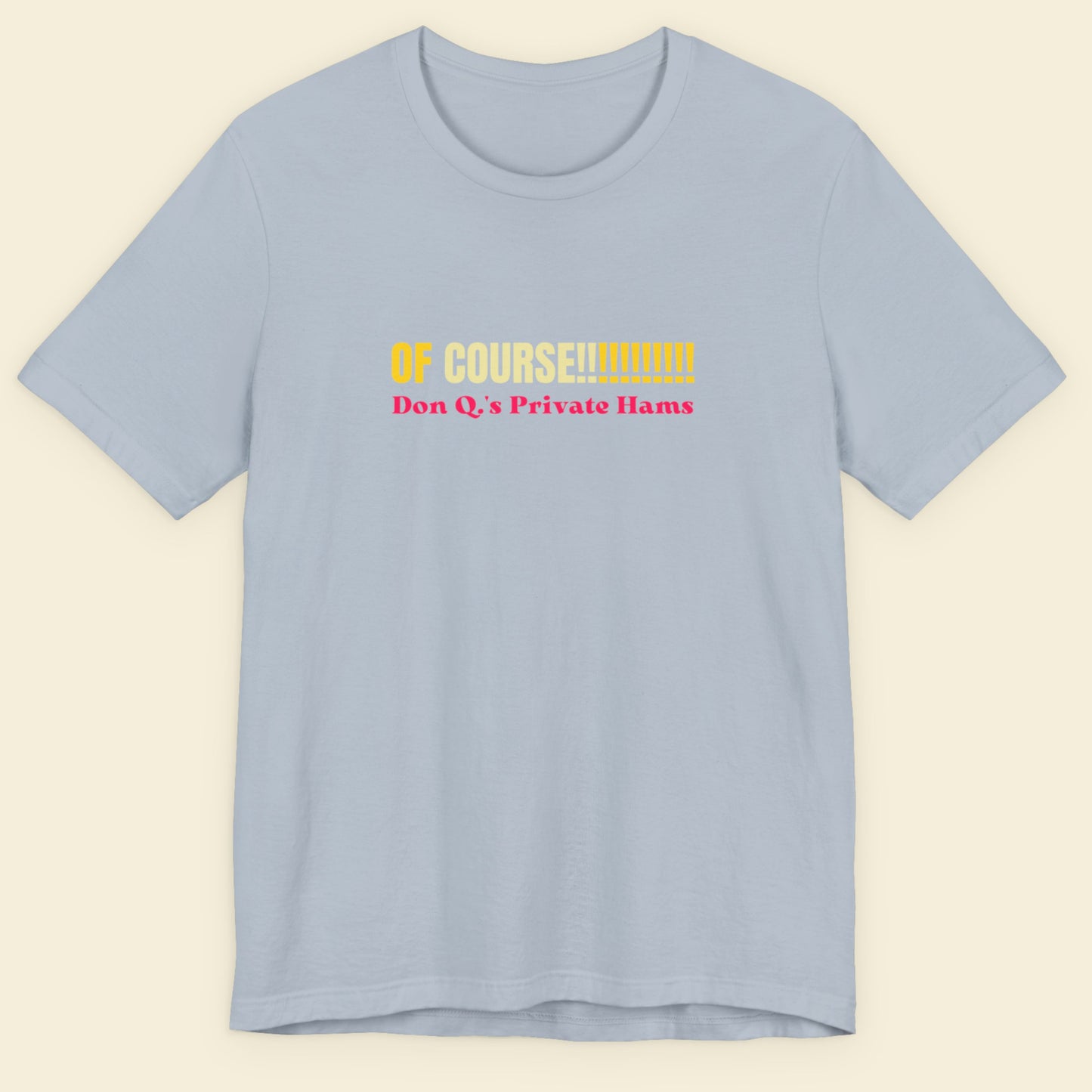 Light blue tee with multicolored 'of course!!!!!!!!!!!' text on a beige background.