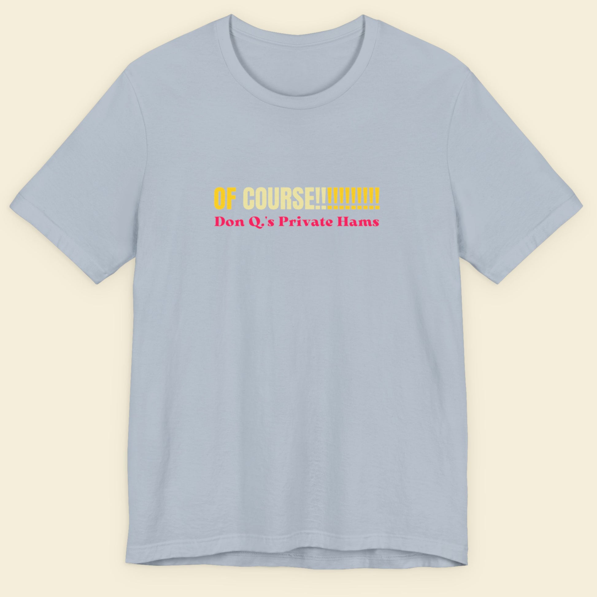 Light blue tee with multicolored 'of course!!!!!!!!!!!' text on a beige background.