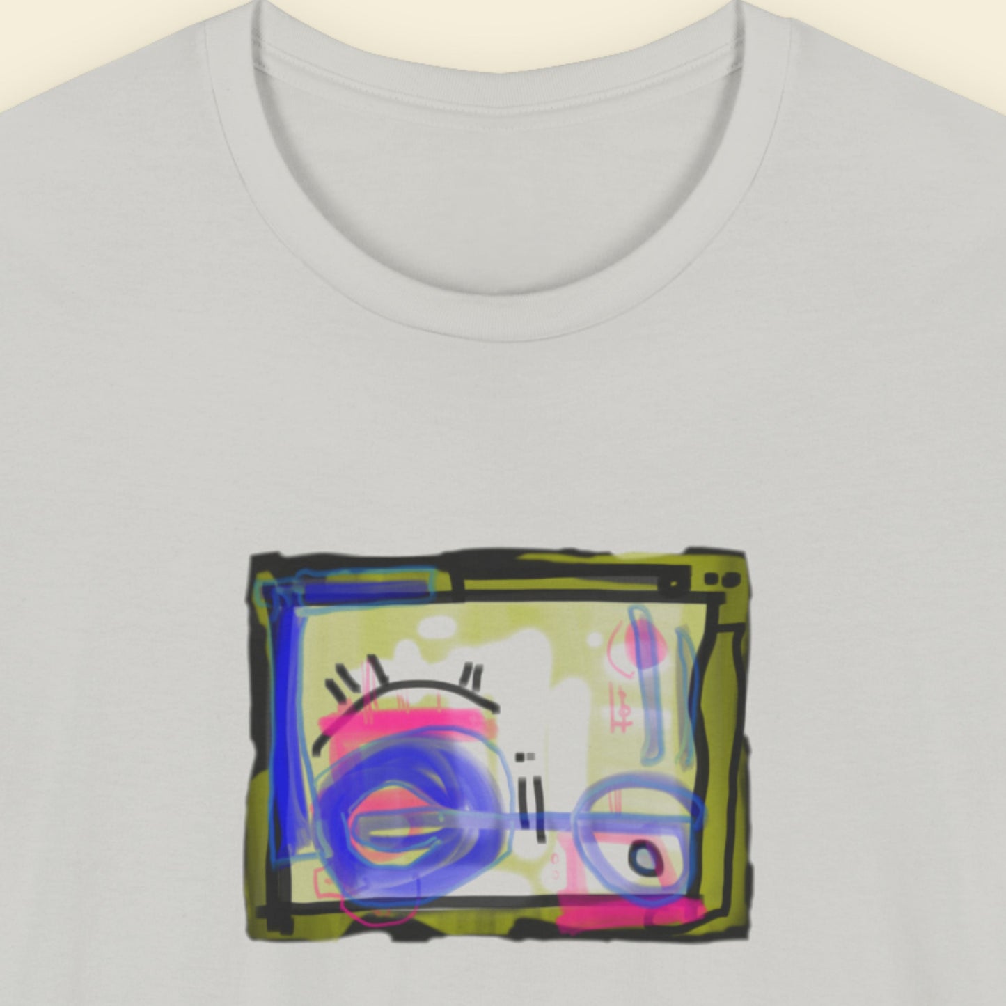 Grey t-shirt with a colorful abstract drawing on a beige background.