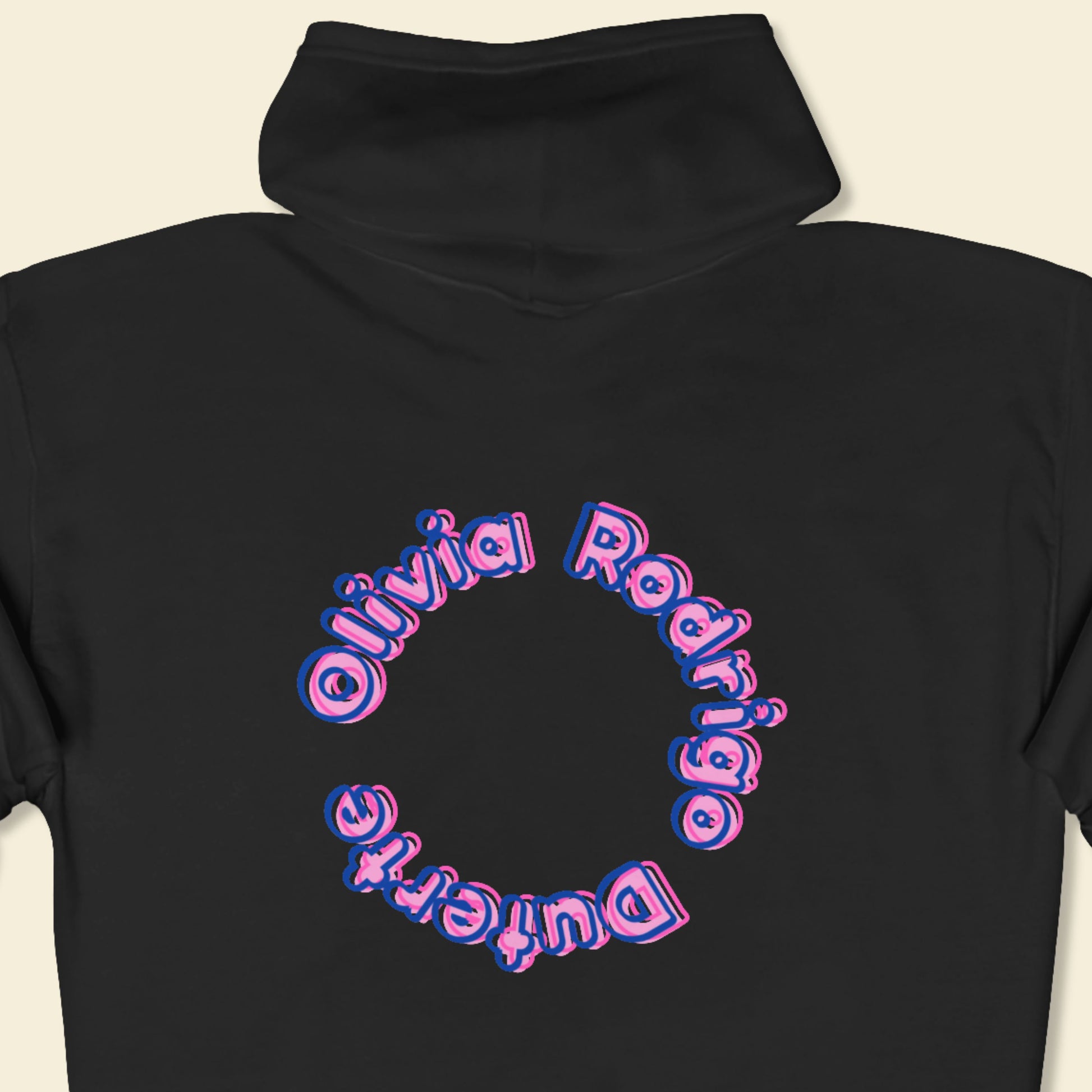 Black hoodie with 'Olivia Rodrigo Duterte' text in a circular design on a beige background.