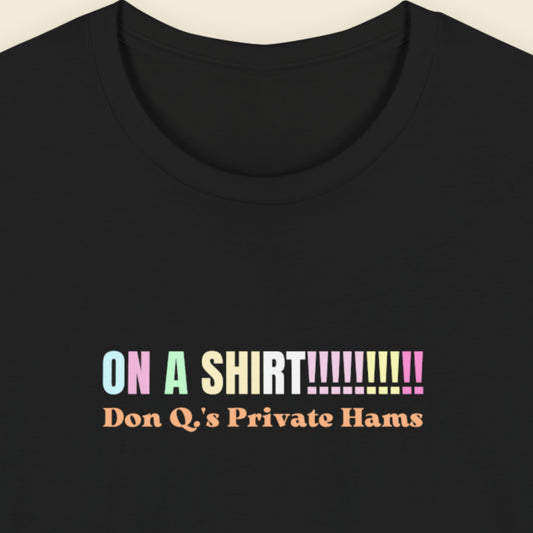 Black t-shirt with humorous colorful text on a beige background.
