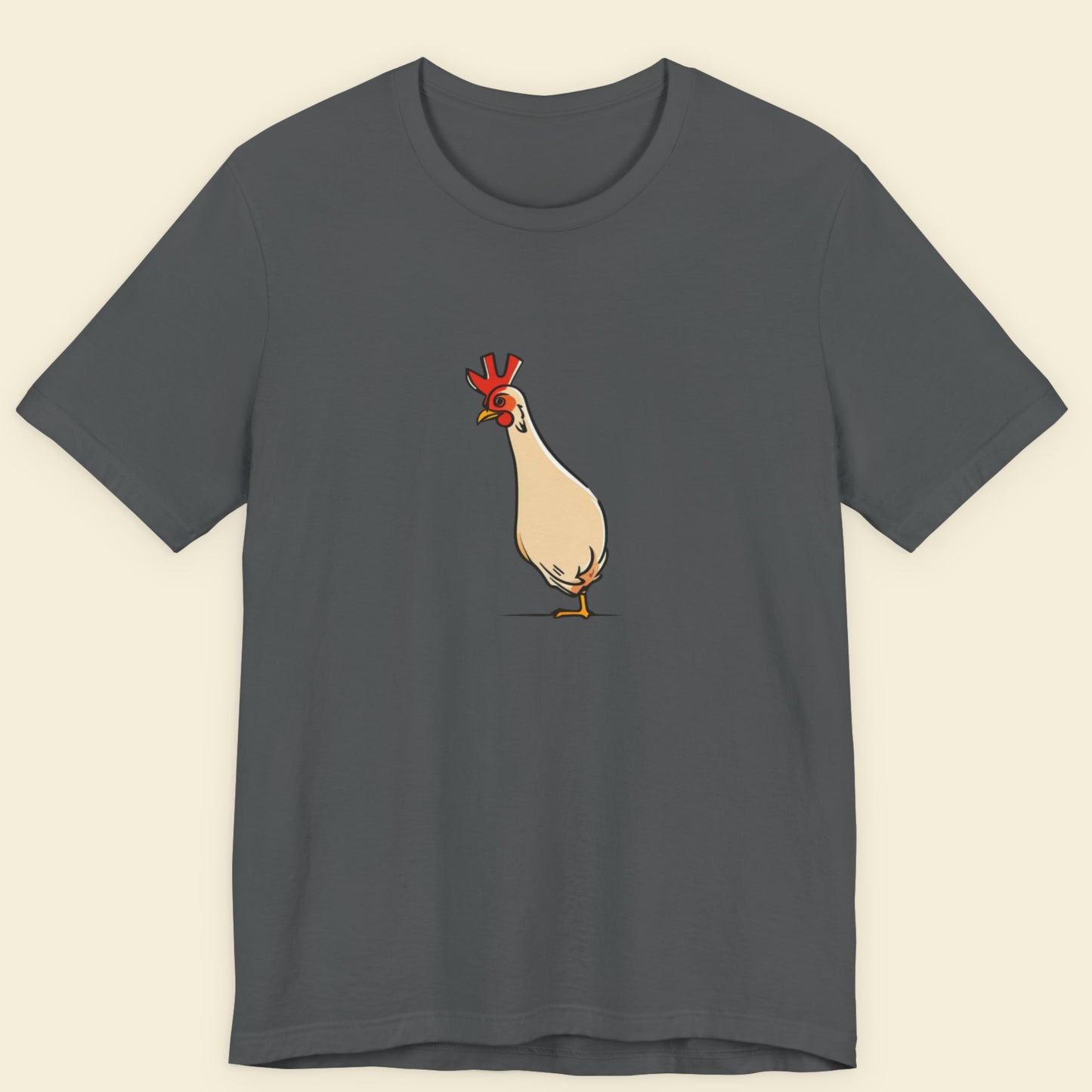 Grey t-shirt with an illustration of a skinny chicken on a beige background.