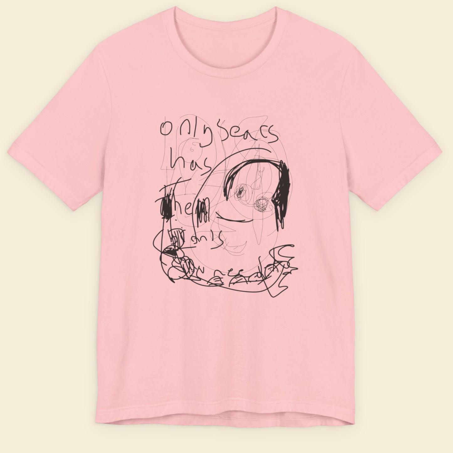 Pink t-shirt with black graphic design and text on a beige background.