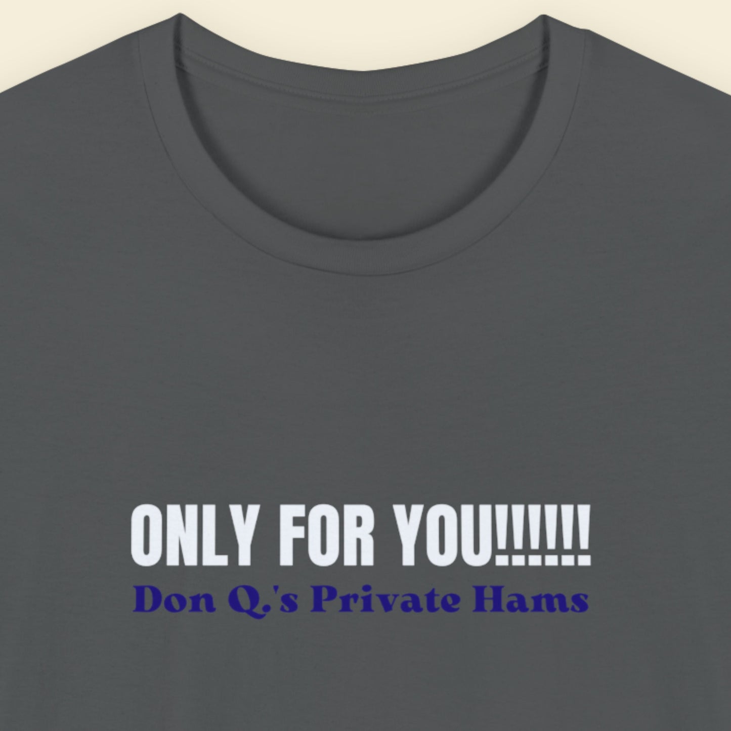 Grey t-shirt with nonsensical text on a beige background.