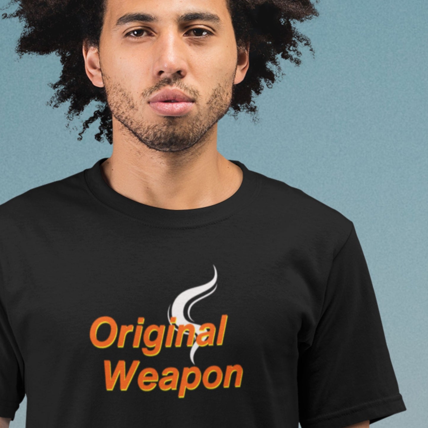 Person wearing a black t-shirt with 'Original Weapon' text and logo on a blue background.