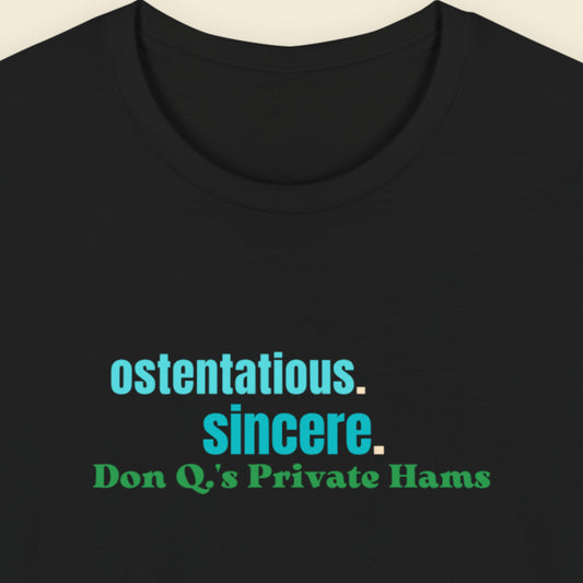 Black t-shirt with blue and green text on a beige background.