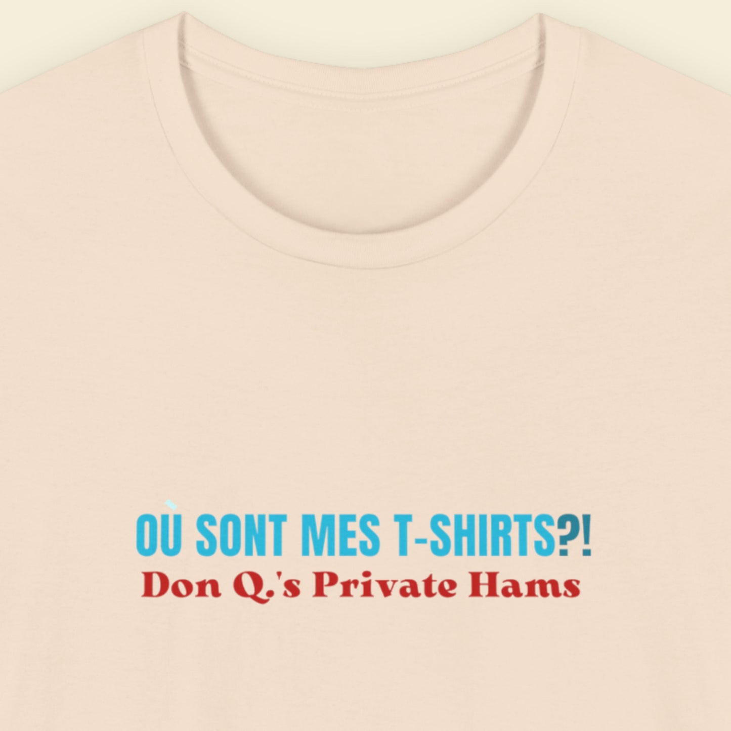 Beige t-shirt with humorous colorful text on a beige background.