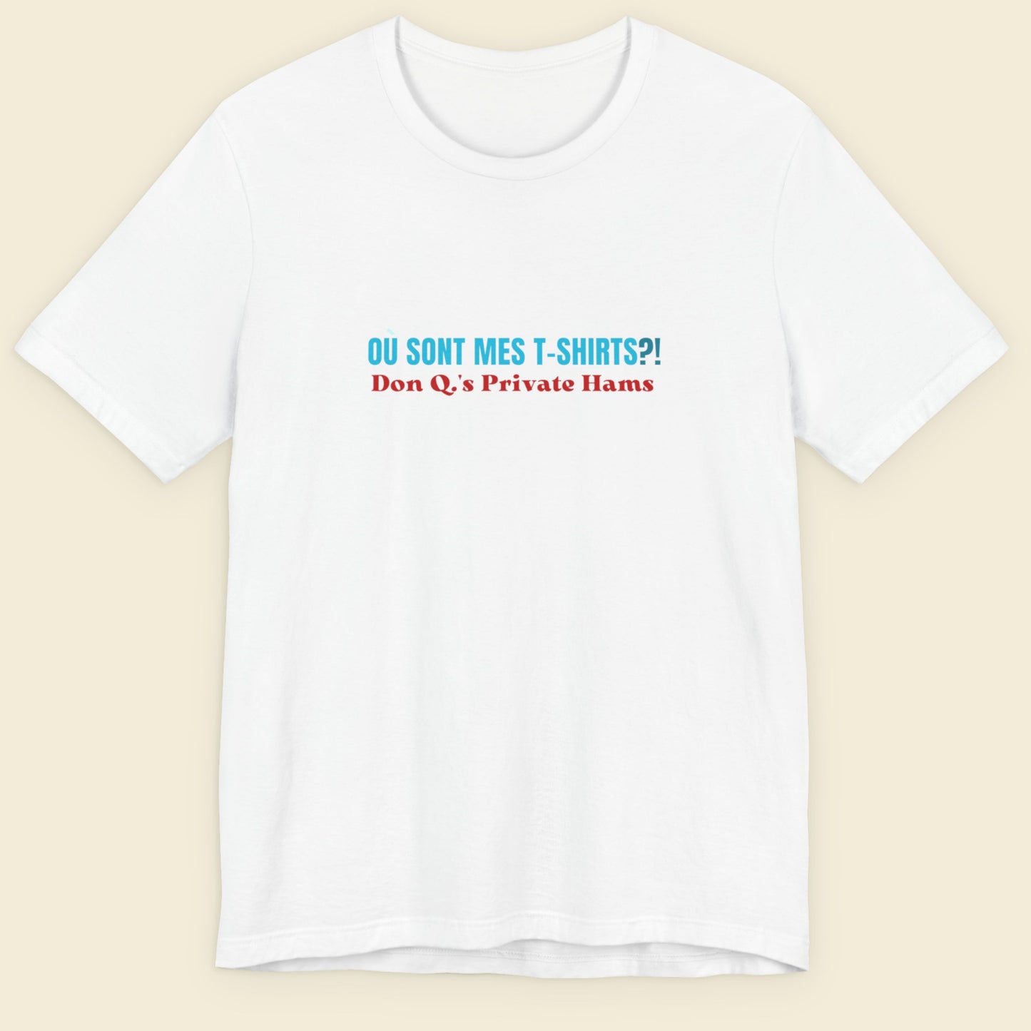 White t-shirt with humorous colorful text on a beige background.