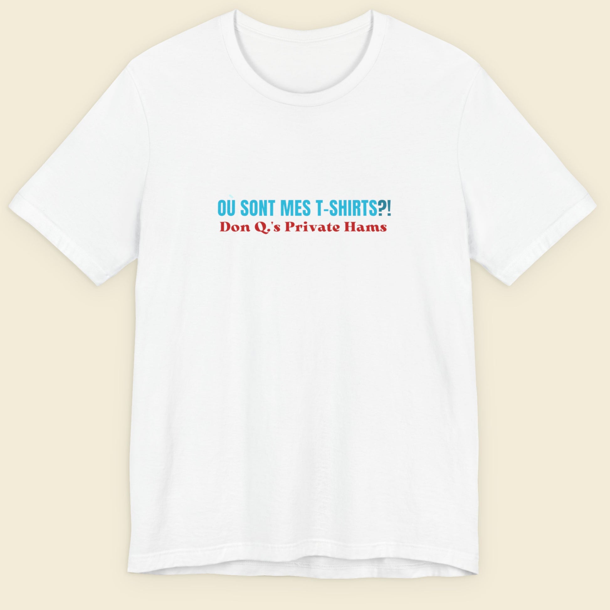 White t-shirt with humorous colorful text on a beige background.